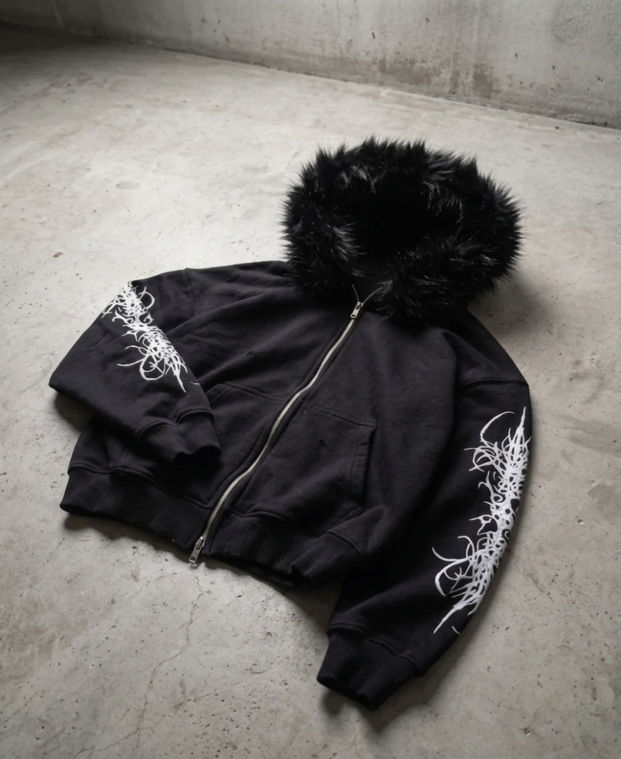 Sudadera con cremallera y sigilo de piel sintética