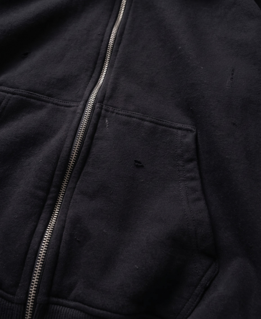 Sudadera con cremallera y sigilo de piel sintética